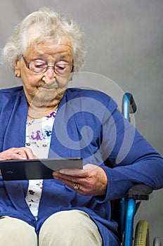 Senior Citizen using a Computer Tablet.