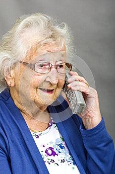 Senior Citizen using a Telephone.