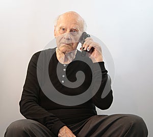 Senior on cordless phone
