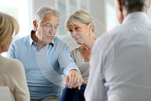 Senior couple attending group therapy