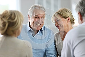 Senior couple attending group therapy photo