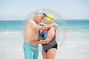 Senior couple with bathing cap at the beach