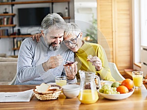 senior couple breakfast home food lifestyle eating table