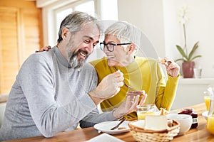 senior couple breakfast home food lifestyle eating table