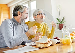 senior couple breakfast home food lifestyle eating table home man woman together husband wife family