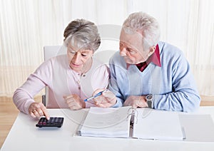 Senior couple calculating budget