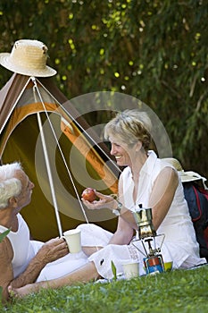 Senior couple camping in a tent