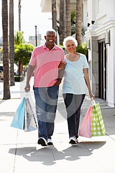 Senior Couple Carrying Shopping Bags