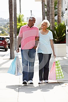 Senior Couple Carrying Shopping Bags