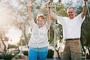 Senior couple celebrating playing miniature golf