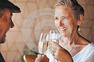 Senior couple, champagne and drinks toast in house or home for marriage anniversary, celebration event or retirement