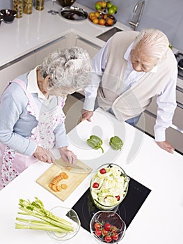 Senior couple chatting in kitchen