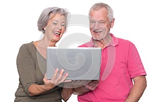 Senior couple with computer