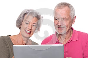 Senior couple with computer
