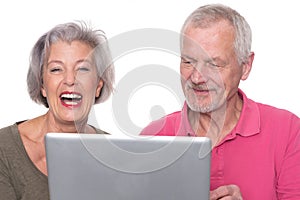 Senior couple with computer