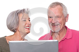 Senior couple with computer