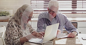 Senior couple, computer and planning for home investment, budget or retirement research and pension funding. Elderly