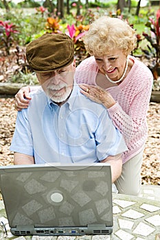 Senior Couple on Computer - Vertical