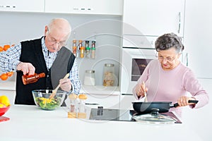Senior couple cooking food kitchen