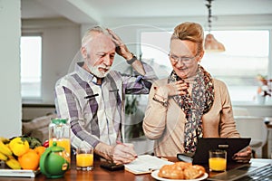 Senior couple counting bills