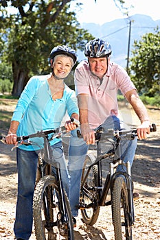 Senior couple on country bike ride photo