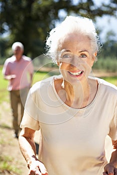 Senior couple on country run