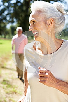 Senior couple on country run