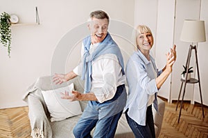 Senior couple dancing active dance at home