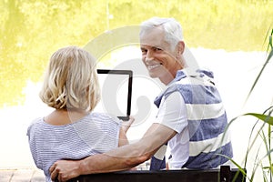 Senior couple with digital tablet