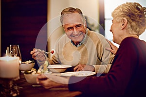 Senior, couple and dinner on date with love on anniversary in retirement with happy marriage. Elderly people, laughing
