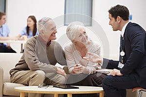 Senior Couple Discussing Test Results With Doctor