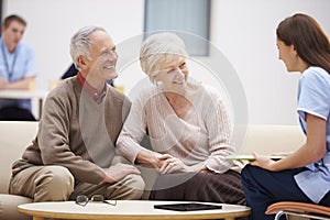 Senior Couple Discussing Test Results With Nurse