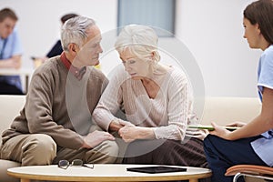 Senior Couple Discussing Test Results With Nurse