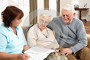 Senior Couple In Discussion With Health Visitor photo