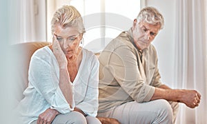 Senior couple, divorce and headache in fight, conflict or argument on the living room sofa at home. Elderly man and