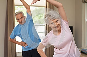 Senior couple doing stretching exercise