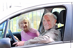 Senior couple driving the car