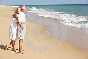 Senior Couple Enjoying Beach Holiday in the sun