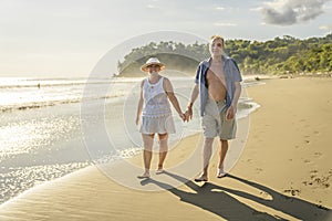 Senior Couple Enjoying Beautiful Sunset on the Beach