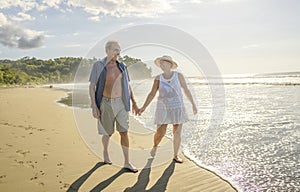 Senior Couple Enjoying Beautiful Sunset on the Beach