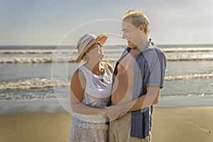 Senior Couple Enjoying Beautiful Sunset on the Beach