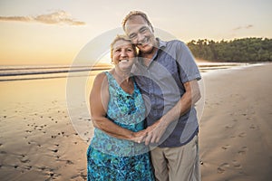 Senior Couple Enjoying Beautiful Sunset on the Beach