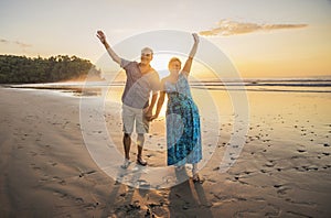 Senior Couple Enjoying Beautiful Sunset on the Beach