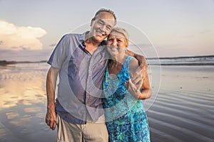 Senior Couple Enjoying Beautiful Sunset on the Beach