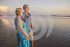 Senior Couple Enjoying Beautiful Sunset on the Beach