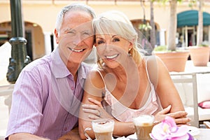 Senior Couple Enjoying Coffee And Cake
