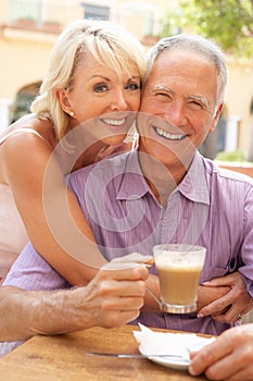 Senior Couple Enjoying Coffee And Cake