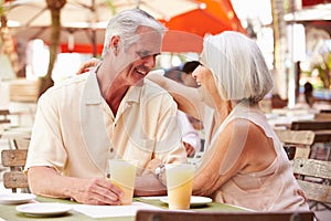 Senior Couple Enjoying Drink In Outdoor CafÃ¯Â¿Â½