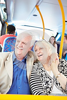 Senior Couple Enjoying Journey On Bus