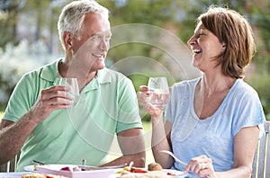 Senior Couple Enjoying Outdoor Meal Together